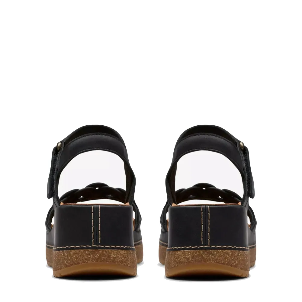Clarks Women's Kassanda Bar Wedge Sandal in Black