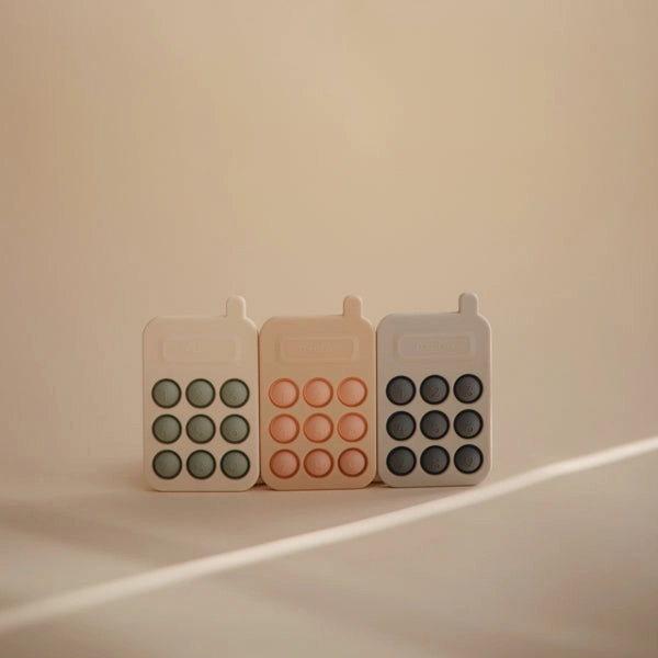 Mushie Phone Press Toy Cambridge Blue